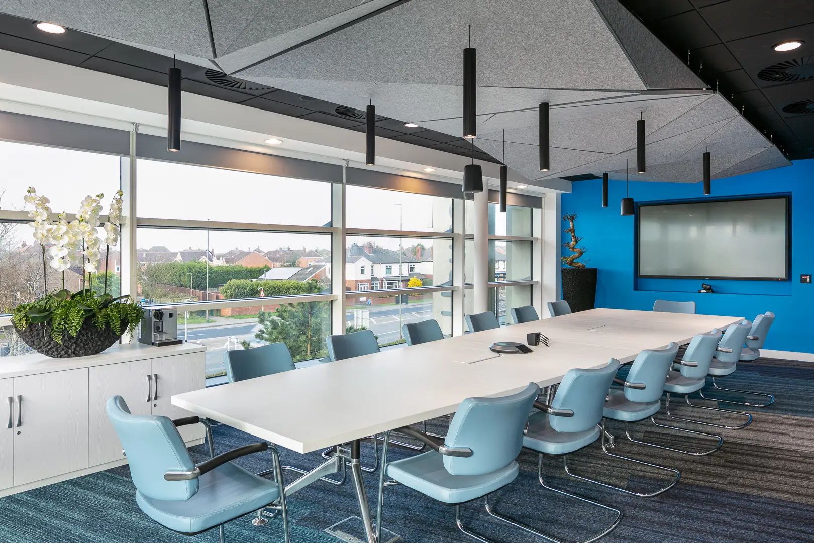 Evri head office meeting room with cylindrical pendant lights