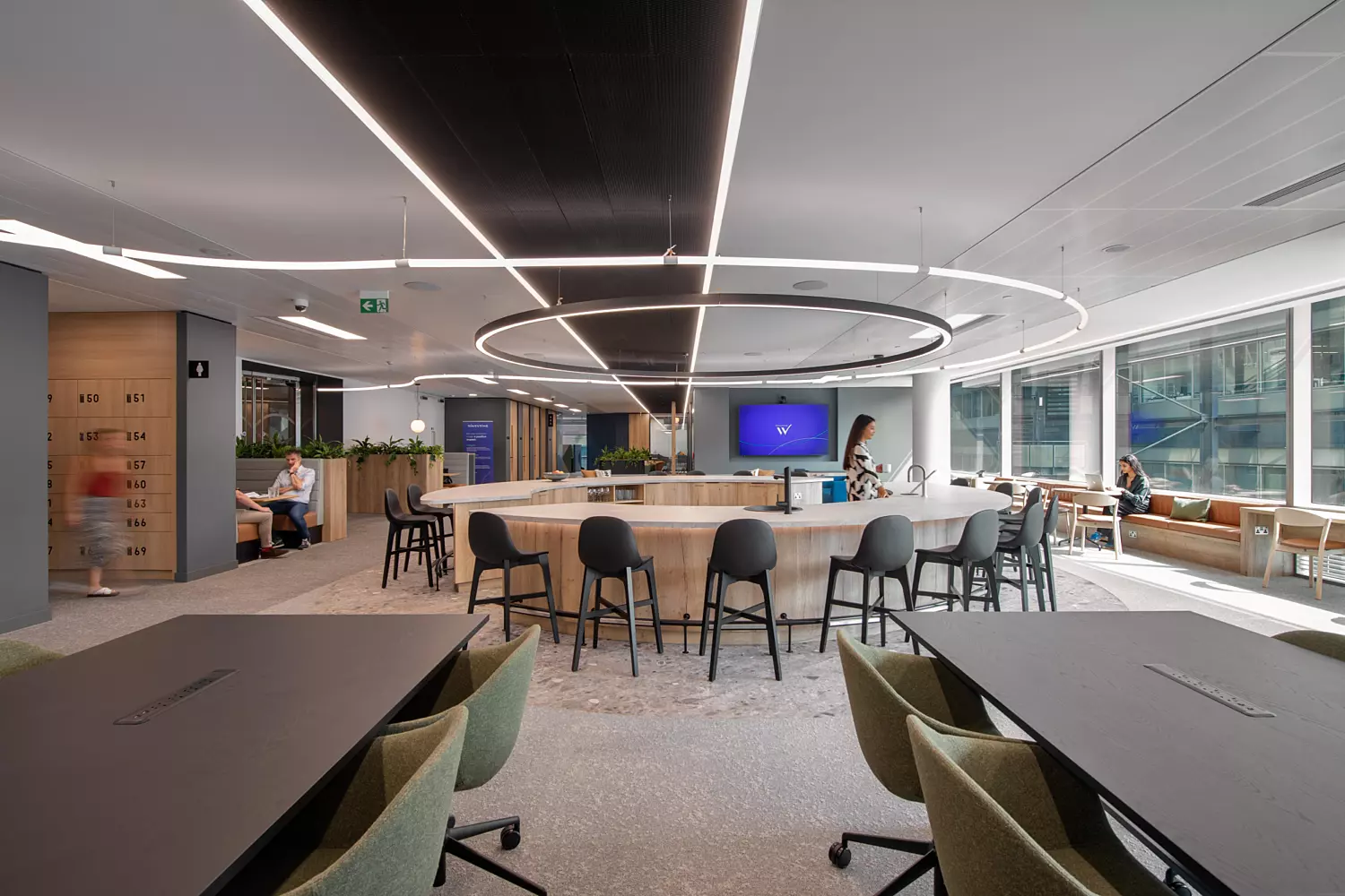 Wavestone communal area with circular tube lighting feature